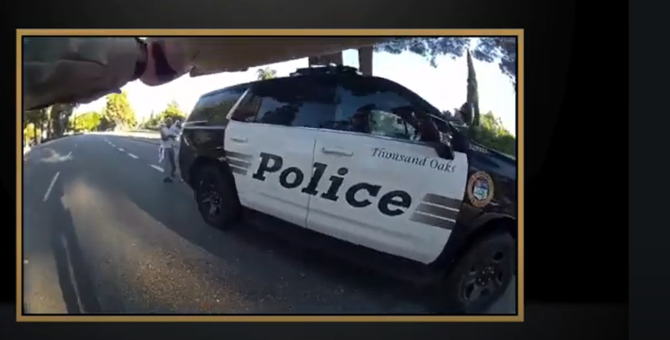 A still photo from a Ventura County Sheriff's Office video of a deputy shooting shows a man with a bow and a knife June 30 in Thousand Oaks. The video was released Wednesday.