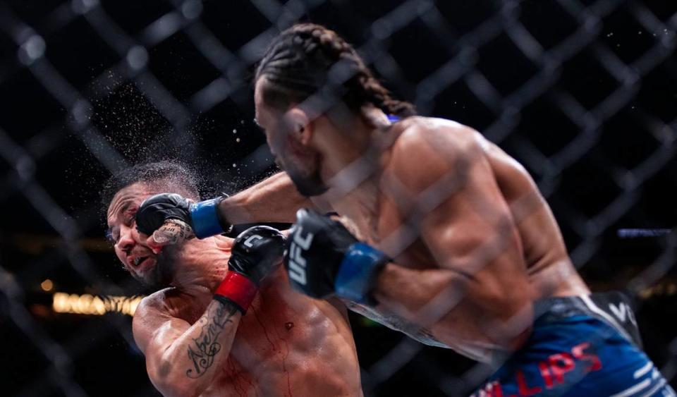 Pedro Munhoz of Brazil fights against Kyler Phillips of the United States during their bantamweight title match during the UFC 299 event at the Kaseya Center on Saturday, March 9, 2024, in downtown Miami, Fla. MATIAS J. OCNER/mocner@miamiherald.com