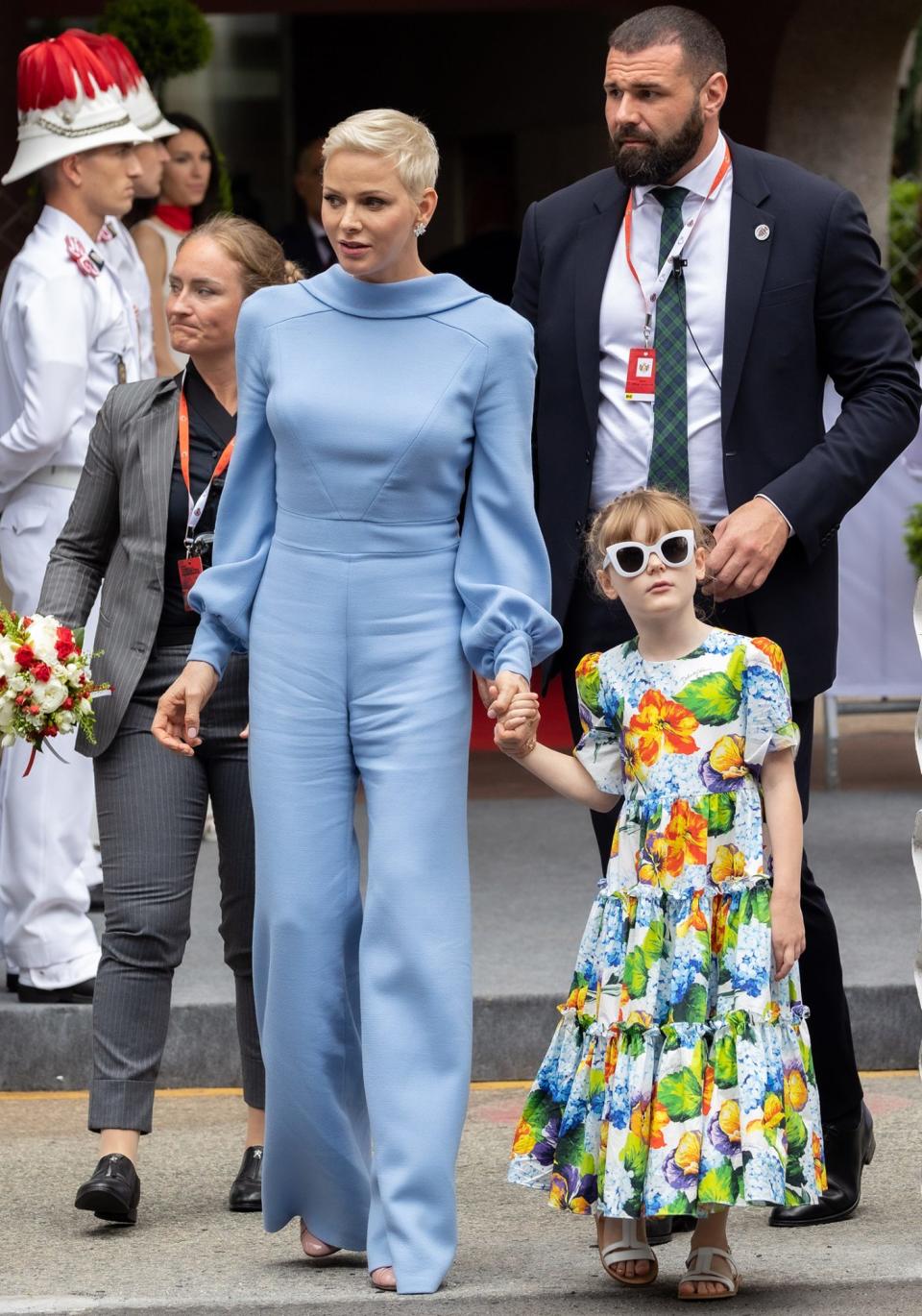 <p>For the Grand Prix, Princess Charlene stunned in powder blue jumpsuit. The ensemble, from South African designer Terrence Bray, featured bishop sleeves and neckline that opened in the back. (Meanwhile, Princess Gabriella made a style statement of her own in a floral dress and sunglasses!)</p>