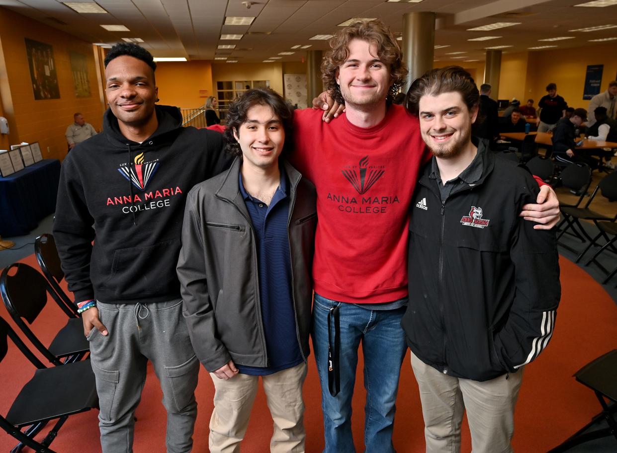 Anna Maria College students, from left; Joshua Alexander of Oklahoma City, Cameron Powell of Grafton, Jarret Niland of Ashaway, Rhode Island, and Elijah Rapaport of Orlando, Florida, attend a ceremony in their honor on Thursday.