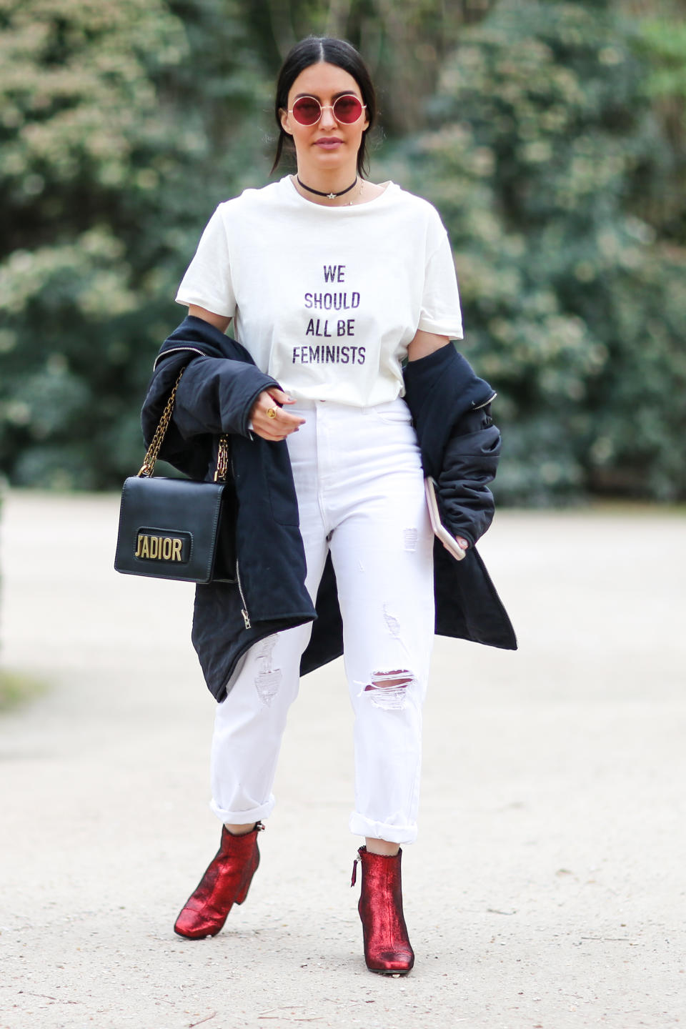 A guest wears sunglasses and a T-shirt with the inscription ‘We should all be feminists’, before the Christian Dior show as part of the Paris Fashion Week in 2017 in Paris, France. (Photo: Edward Berthelot/Getty Images)