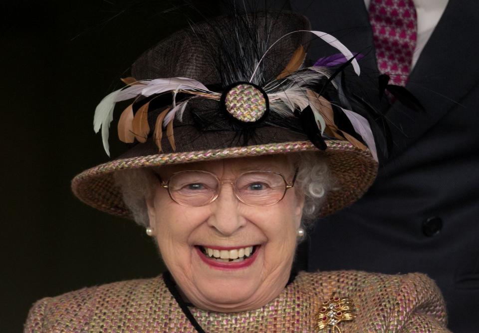 The Queen getting ecstatic at a horse race.