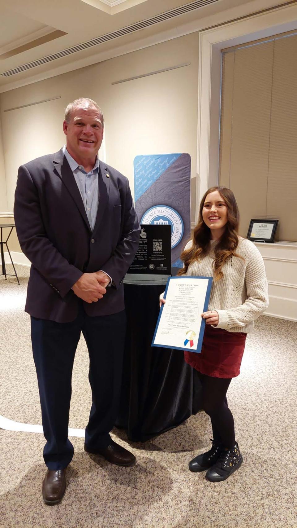 Mayor Glenn Jacobs presents Mia Warren with a proclamation naming it Mia Warren Day at the Museum of East Tennessee History on Jan. 3, 2024.