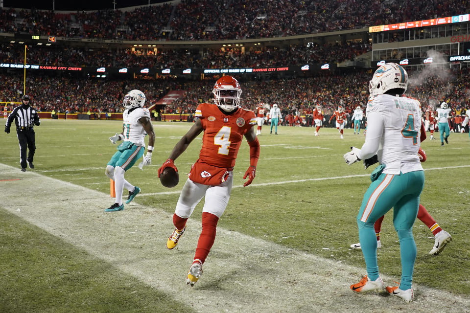 Kansas City Chiefs wide receiver Rashee Rice (4) celebrates after scoring against the Miami Dolphins during the first half of an NFL wild-card playoff football game Saturday, Jan. 13, 2024, in Kansas City, Mo. (AP Photo/Charlie Riedel)