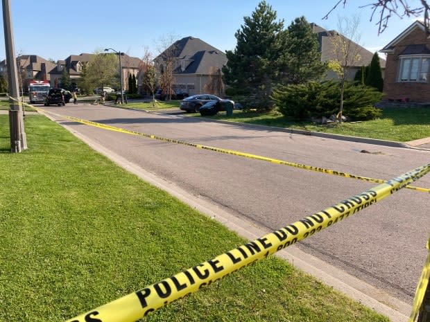 Officers said a black Mercedes Benz struck three people who were in a driveway, including an 11-year-old girl and her 4-year-old brother.  (Mark Bochsler/CBC - image credit)