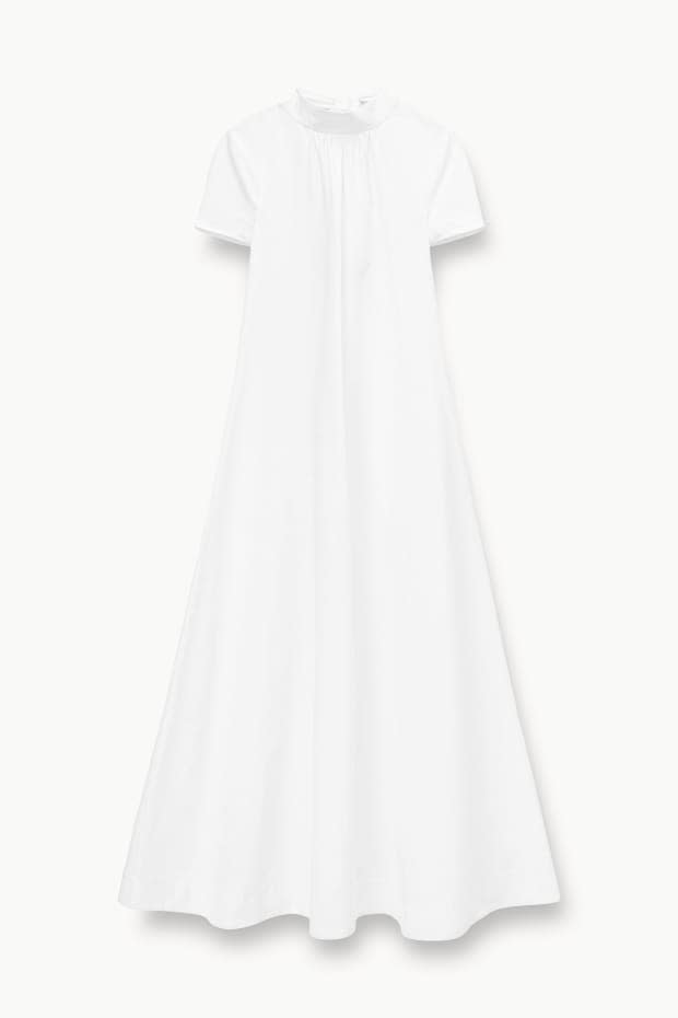 <p>Staud Ilana Dress, $375, <a href="https://staud.clothing/collections/staud-bride/products/ilana-dress-white?variant=41693726343341" rel="nofollow noopener" target="_blank" data-ylk="slk:available here;elm:context_link;itc:0;sec:content-canvas" class="link ">available here</a> (sizes XS-XL)</p>