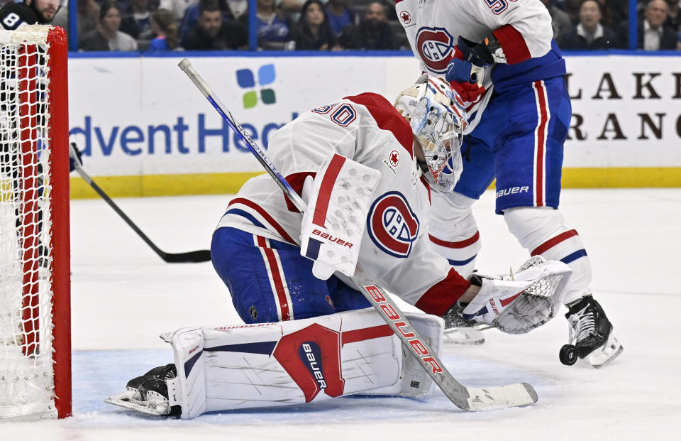 Montreal Canadiens goaltender Cayden Primeau (30) makes a save during the second period of an NHL hockey game against the Tampa Bay Lightning, Saturday, March 2, 2024, in Tampa, Fla. (AP Photo/Jason Behnken)