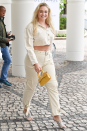 <p>Iskra Lawrence makes the case for using a saffron-yellow bag to lift an ivory co-ord. Paired with snakeskin-print mules, it takes the look from pared-back to powered up.</p>