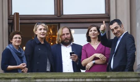 Leaders of the German Green Party Britta Hasselmann, Simone Peter, Anton Hofreiter, Katrin Goering-Eckardt and Cem Ozdemir are seen on the balcony of German Parliamentary Society offices prior to the exploratory talks with CDU/CSU about forming a new coalition government in Berlin, Germany, October 18, 2017. REUTERS/Hannibal Hanschke