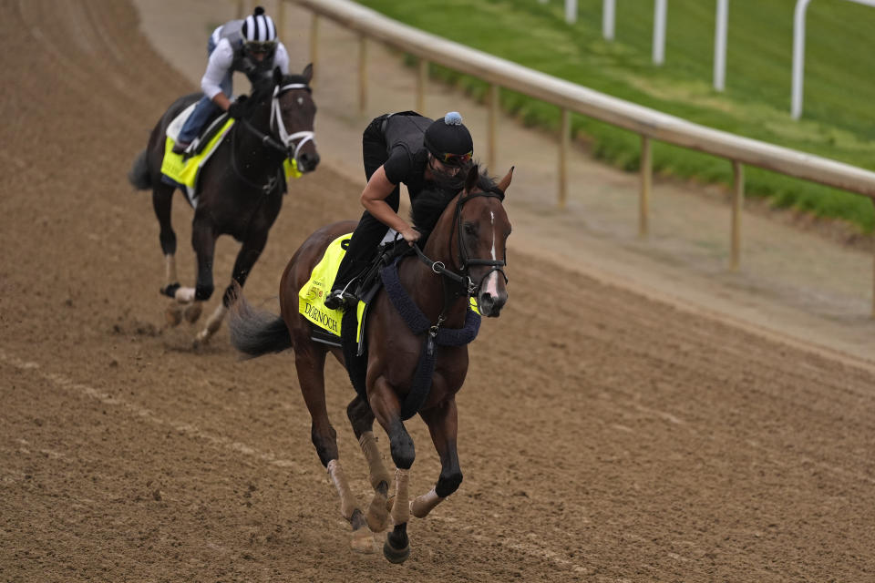 Kentucky Derby hopefuls Dornoch, front, and Endlessly work out at Churchill Downs Tuesday, April 30, 2024, in Louisville, Ky. The 150th running of the Kentucky Derby is scheduled for Saturday, May 4. (AP Photo/Charlie Riedel)