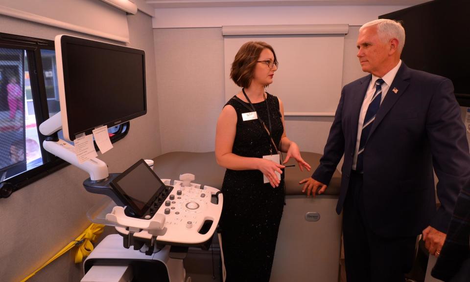 Mike Pence tours the Carolina Pregnancy Center's mobile unit with Carla Beasley, nurse manager with CPC, showing ultrasound equipment.