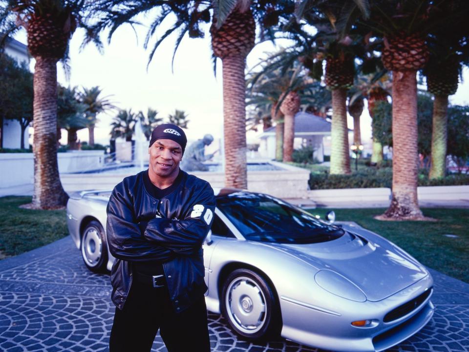 Mike Tyson and his car Jaguar.