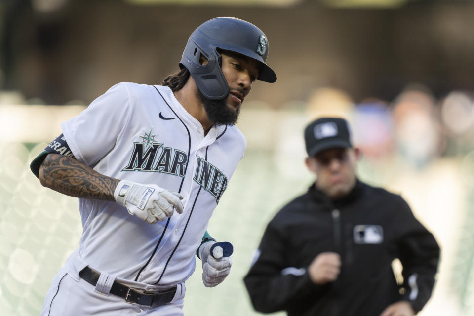 Seattle Mariners' J.P. Crawford rounds the bases after hitting a solo home run off of Minnesota Twins starting pitcher J.A. Happ during the first inning of a baseball game Tuesday, June 15, 2021, in Seattle. (AP Photo/Stephen Brashear)