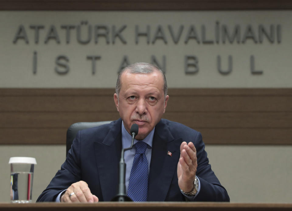 Turkey's President Recep Tayyip Erdogan speaks to reporters before leaving for Bosnia, in Istanbul, Monday, July 8, 2019. Erdogan says Russia's S-400 air defense missiles are currently being prepared to be flown to Turkey. Erdogan would not however say when the Russian missile defense system would reach Turkey or where they will be deployed.(Presidential Press Service via AP, Pool)