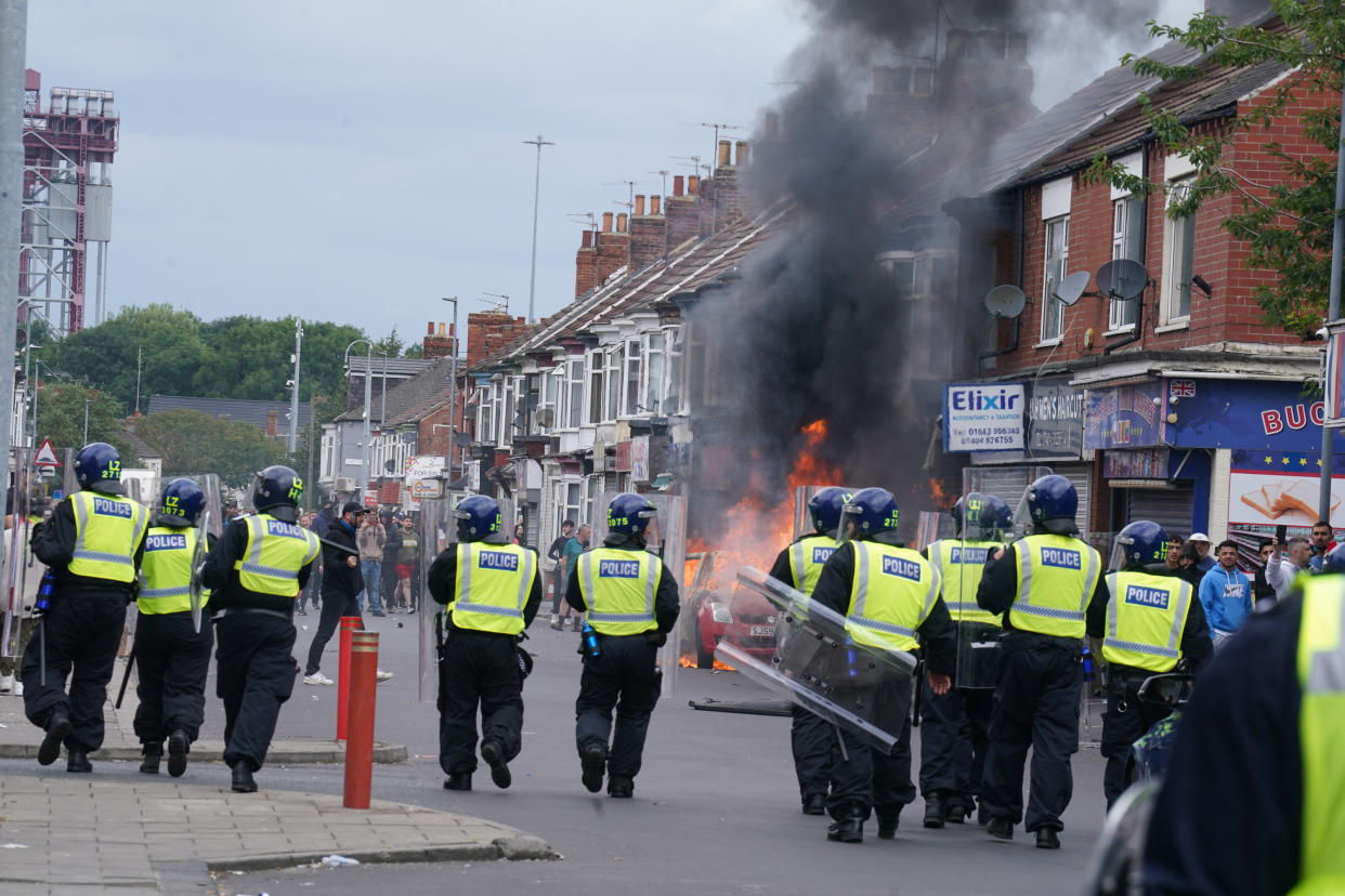 A car burns during an anti-immigration protest in Middlesbrough. Picture date: Sunday August 4, 2024. (Photo by Owen Humphreys/PA Images via Getty Images)