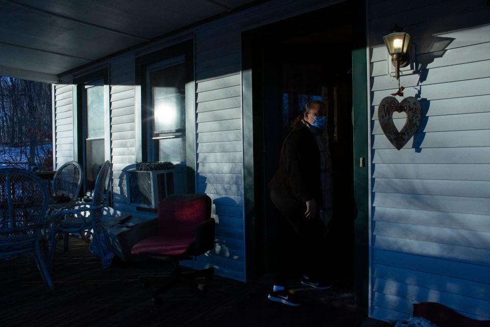 Volunteer Cheryl Bullock-Hannah opens the door of the Strengthen Our Sisters shelter in Paterson, N.J., on Feb. 25.