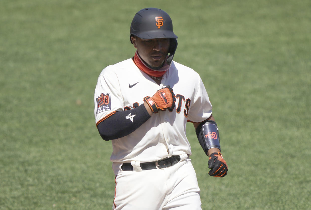 SAN FRANCISCO, CALIFORNIA - AUGUST 02: Chadwick Tromp #14 of the San Francisco Giants celebrates after he hit a two-run home run against the Texas Rangers in the bottom of the six inning at Oracle Park on August 02, 2020 in San Francisco, California. (Photo by Thearon W. Henderson/Getty Images)