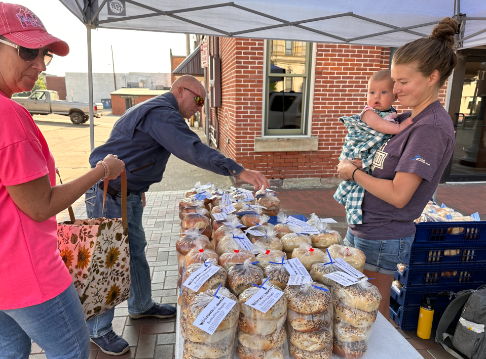 Woo Town Bagels sells morning creations at a previous downtown Wooster Farmers Market, which open for the season on Saturday.