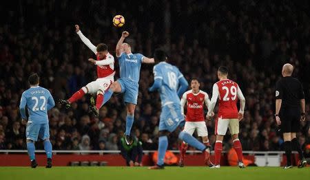 Football Soccer Britain - Arsenal v Stoke City - Premier League - Emirates Stadium - 10/12/16 Arsenal's Alex Oxlade-Chamberlain in action with Stoke City's Charlie Adam Reuters / Clodagh Kilcoyne Livepic