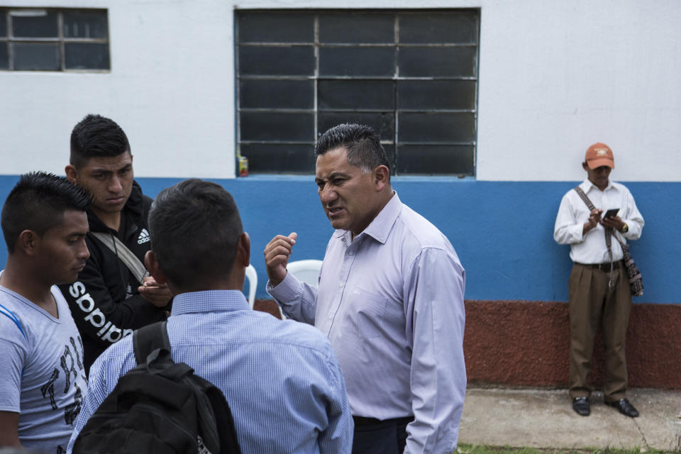 Hector Hernandez Cumar, Mayor of San Martin Jilotepeque, speaks with neighbors after a political rally of the National Party of Hope, Guatemala, Sunday, August 4, 2019. Hernandez also speaks to the residents of the township's dozen or so hamlets over a loudspeaker, telling them not to rent rooms to foreigners."I don't want any of you letting unknown people in, renting them rooms or houses, renting is forbidden," Hernandez said. (AP Photo/ Oliver de Ros)