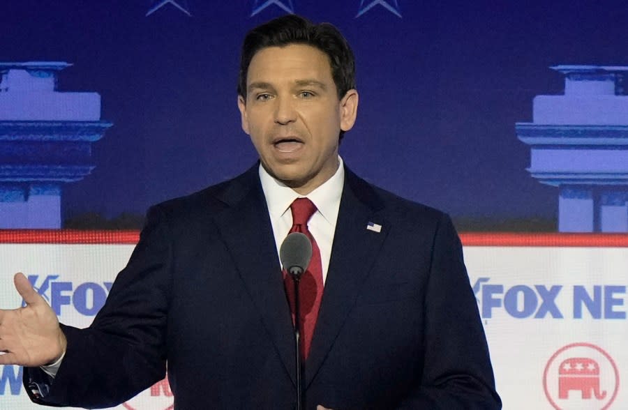 Florida Gov. Ron DeSantis and businessman Vivek Ramaswamy speak at the same time during a Republican presidential primary debate hosted by FOX News Channel Wednesday, Aug. 23, 2023, in Milwaukee. (AP Photo/Morry Gash)