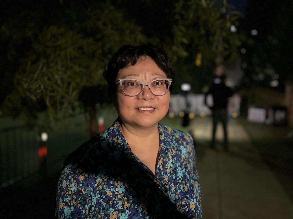 Rebecca Zhang, 60, travels two hours a day to be at this vigil. She says her husband was persecuted for attending the 1989 Tiananmen Square protests in China. She feels a kinship to the J6ers and comes here to support them.