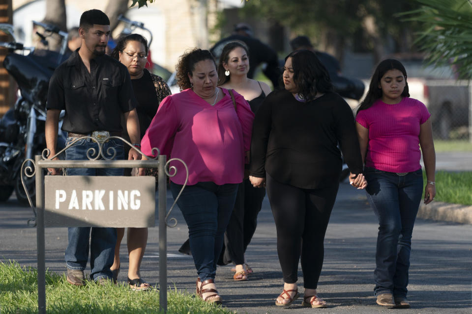 People leave a funeral home after attending a visitation for Amerie Garza, a 10-year-old victim who was killed in last week's elementary school shooting in Uvalde, Texas, Monday, May 30, 2022. (AP Photo/Jae C. Hong)