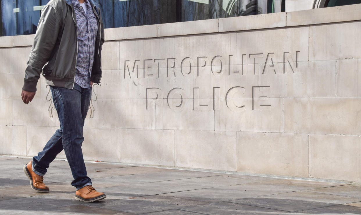 LONDON, UNITED KINGDOM - 2023/03/21: A man walks past the Metropolitan Police sign outside New Scotland Yard as Baroness Louise Caseys report on the Metropolitan Police is published, which describes the force as Institutionally racist, misogynist and homophobic. (Photo by Vuk Valcic/SOPA Images/LightRocket via Getty Images)