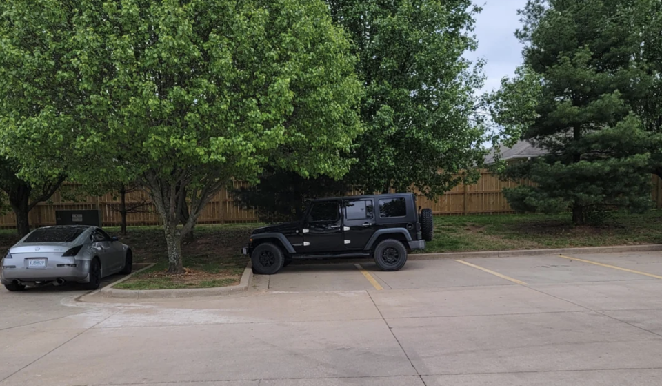 car parked across 2 spots