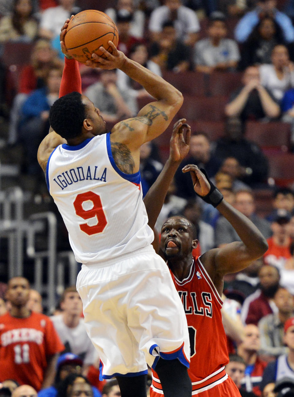 PHILADELPHIA, PA - MAY 10: Andre Iguodala #9 of the Philadelphia 76ers takes a shot over Luol Deng #9 of the Chicago Bulls in Game Six of the Eastern Conference Quarterfinals in the 2012 NBA Playoffs at the Wells Fargo Center on May 10, 2012 in Philadelphia, Pennsylvania. NOTE TO USER: User expressly acknowledges and agrees that, by downloading and or using this photograph, User is consenting to the terms and conditions of the Getty Images License Agreement. (Photo by Drew Hallowell/Getty Images)