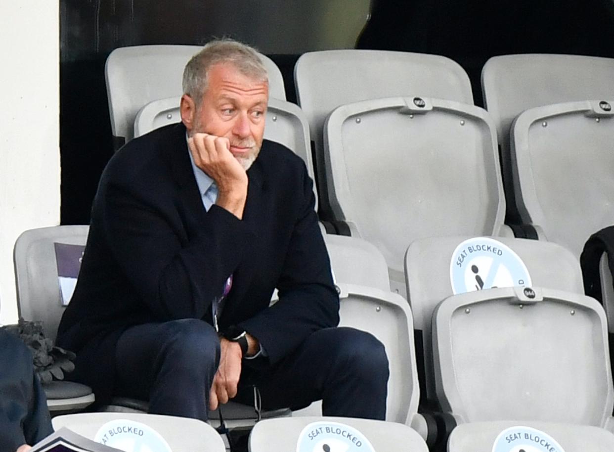 Roman Abramovich, the Russian billionaire owner of Chelsea Football Club, sits in the stands with chin resting on hand