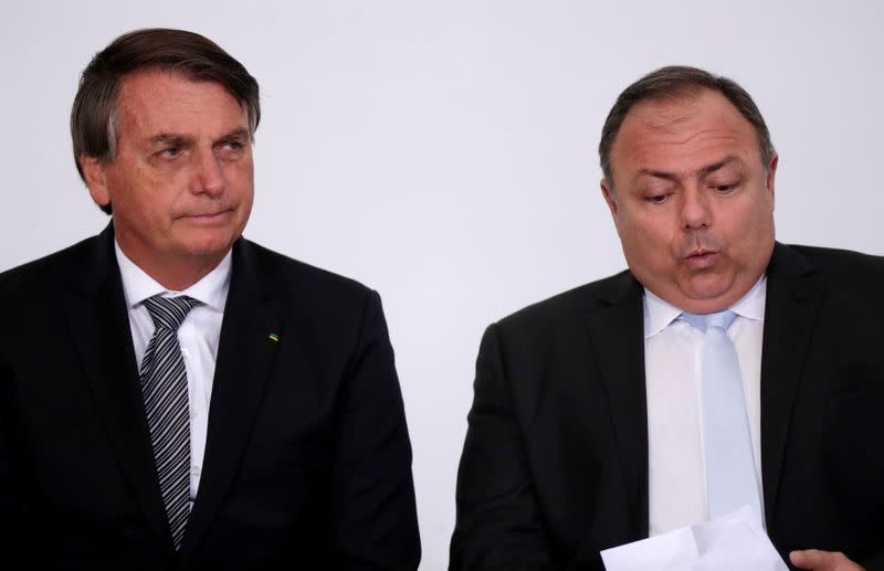 Brazil's President Jair Bolsonaro and Brazil's Health Minister Eduardo Pazuello attend the launch ceremony of a training program for health workers at the Planalto Palace, in Brasilia