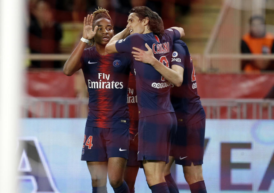 PSG's Edinson Cavani, center, celebrates with teammates after scoring during the French League One soccer match between AS Monaco and Paris Saint-Germain at Stade Louis II in Monaco, Sunday, Nov. 11, 2018 (AP Photo/Claude Paris)