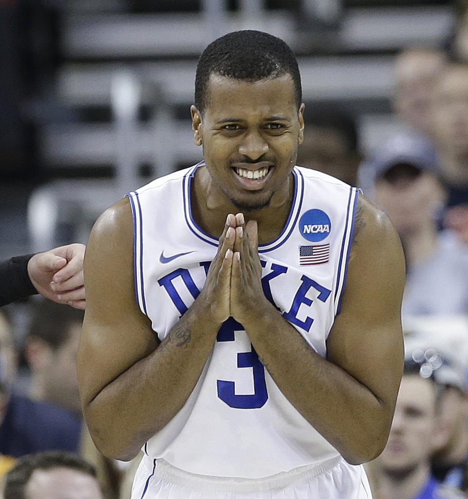 Duke guard Tyler Thornton (3) reacts to play against Mercer during the first half of an NCAA college basketball second-round game, Friday, March 21, 2014, in Raleigh, N.C. (AP Photo/Gerry Broome)