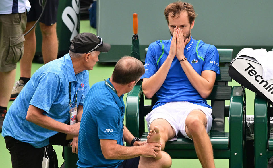 Daniil Medvedev, pictured here as a trainer checks his foot at Indian Wells.