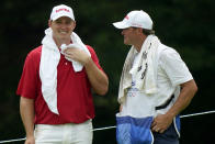 Sepp Straka, of Austria, left, smiles with his caddy on the 15th green during the first round for the men's golf event at the 2020 Summer Olympics, Thursday, July 29, 2021, at the Kasumigaseki Country Club in Kawagoe, Japan, (AP Photo/Matt York)