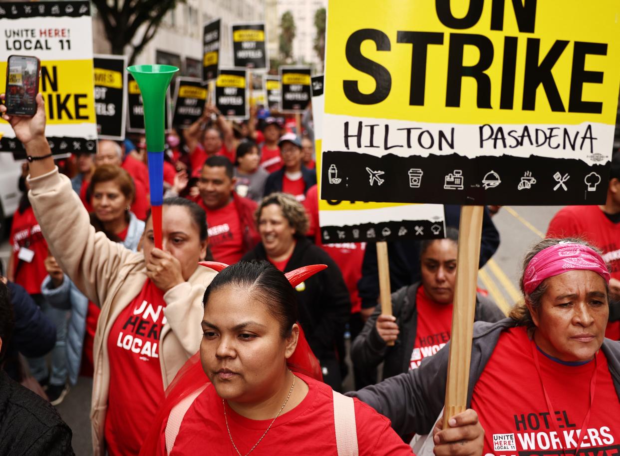 Hotel workers with Unite Here Local 11 march through downtown L.A. calling for a fair contract from numerous major hotels in the region on October 25, 2023 in Los Angeles, California.