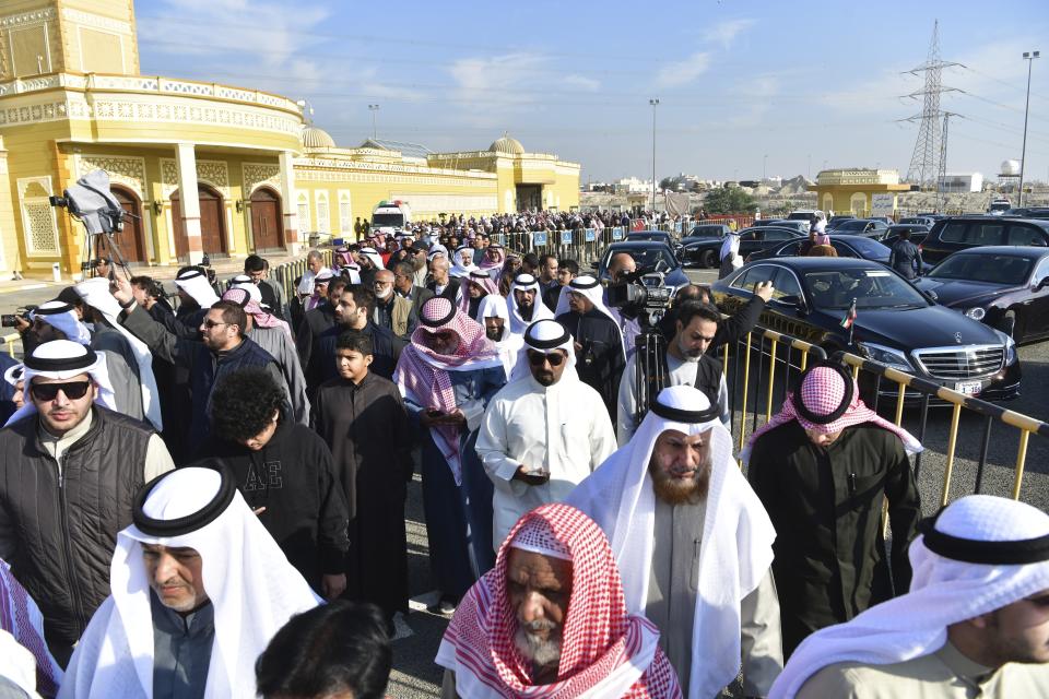 People leave after the funeral ceremony of the Emir of Kuwait Sheikh Nawaf Al Ahmad Al Sabah at the Bilal bin Rabah Mosque in Al-Siddiq district of Kuwait, Sunday, Dec. 17, 2023. Kuwait’s ruling emir, died on Saturday after a three-year, low-key reign focused on trying to resolve the tiny, oil-rich nation's internal political disputes. He was 86. (AP Photo/Jaber Abdulkhaleg)