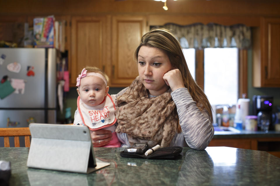 WILMINGTON, MA - MARCH 15: Erica Jensen, with her 5-month-old daughter, Charlee Jaques, by her side, video conferenced with her doctor, Dr. Marie McDonnell, from her mother's home in Wilmington, Mass. on Tuesday afternoon, March 15, 2016. (Photo by Dina Rudick/The Boston Globe via Getty Images)