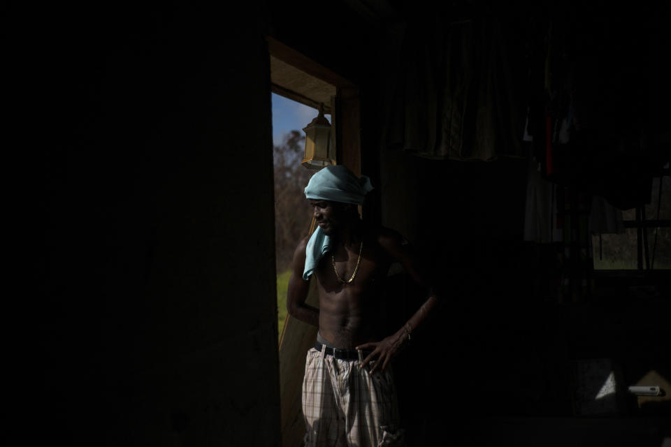 Trevon Laing stands on the frame of his house destroyed by Hurricane Dorian, in Gold Rock Creek, Grand Bahama, Bahamas, Thursday Sept. 12, 2019. Trevor says "After the hurricane they had me for dead, My momma was crying." When he returned, he said he found his brother crying on the front porch."I'm like, 'Hey, I'm not dead! You guys have no faith in me. I'm a survivor,'" he said, adding with a laugh, "He was shocked and mad at the same time." (AP Photo / Ramon Espinosa)