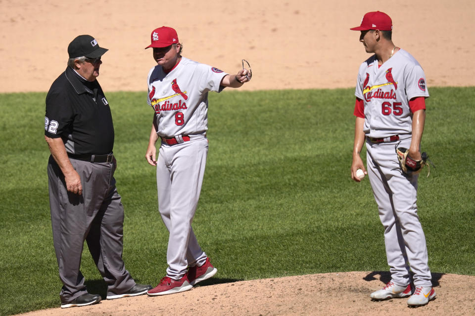 St. Louis Cardinals manager Mike Shildt, center, continues to speak his mind as he points to relief pitcher Giovanny Gallegos after third base umpire Joe West, left, ejected Shildt during the seventh inning of an interleague baseball game against the Chicago White Sox Wednesday, May 26, 2021, in Chicago. (AP Photo/Charles Rex Arbogast)