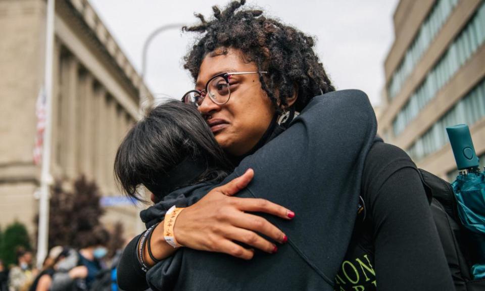 Demonstrators react to the grand jury verdict in the Breonna Taylor killing on 23 September.