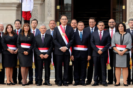 Peru's President Martin Vizcarra and new ministers pose for a picture during their swearing-in ceremony at the government palace in Lima, Peru, April 2, 2018. REUTERS/Guadalupe Pardo