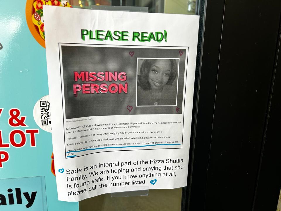 A missing poster for Sade Carleena Robinson is seen April 8, 2024, at Pizza Shuttle on Milwaukee’s east side, where Robinson worked for three years.