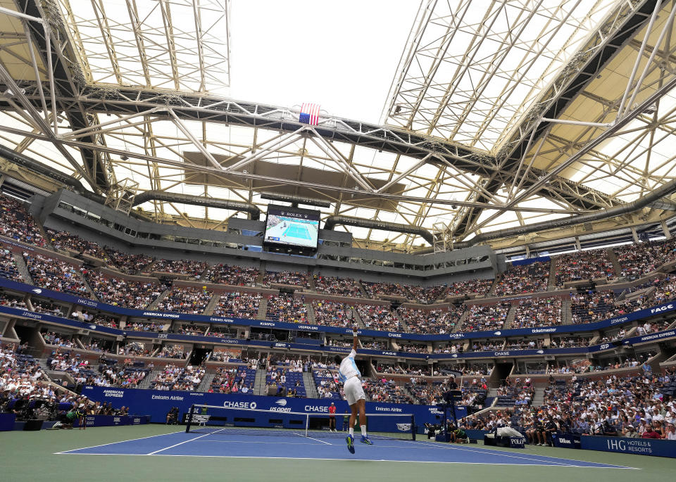 Novak Djokovic, of Serbia, serves to Taylor Fritz, of the United States, during the quarterfinals of the U.S. Open tennis championships, Tuesday, Sept. 5, 2023, in New York. (AP Photo/Manu Fernandez)