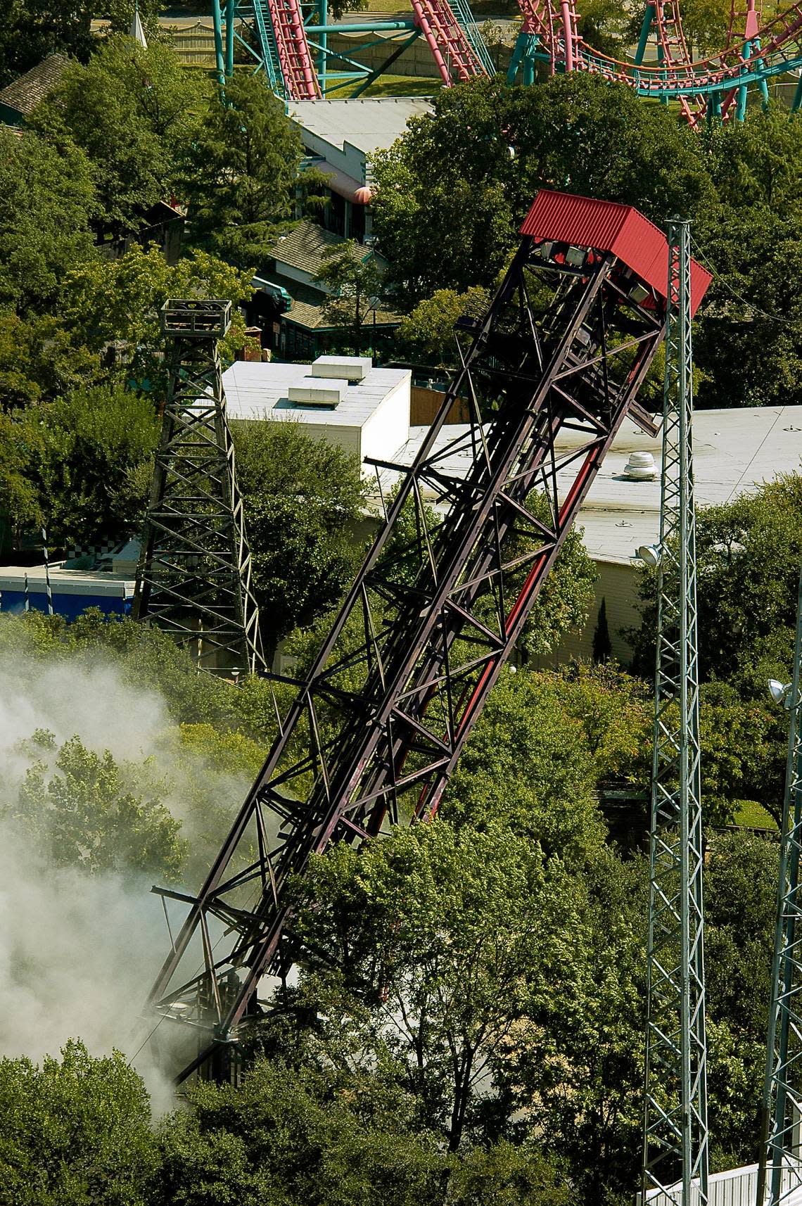 Oct. 2, 2007: The implosion of the Wildcatter ride at Six Flags Over Texas as viewed from the oil derrick tower. The park imploded the ride to make room for its new ride for the 2008 season, the Tony Hawk’s Big Spin ride. The implosion of the 25-year-old, 128-foot Wildcatter was done by Dallas Demolition Co.