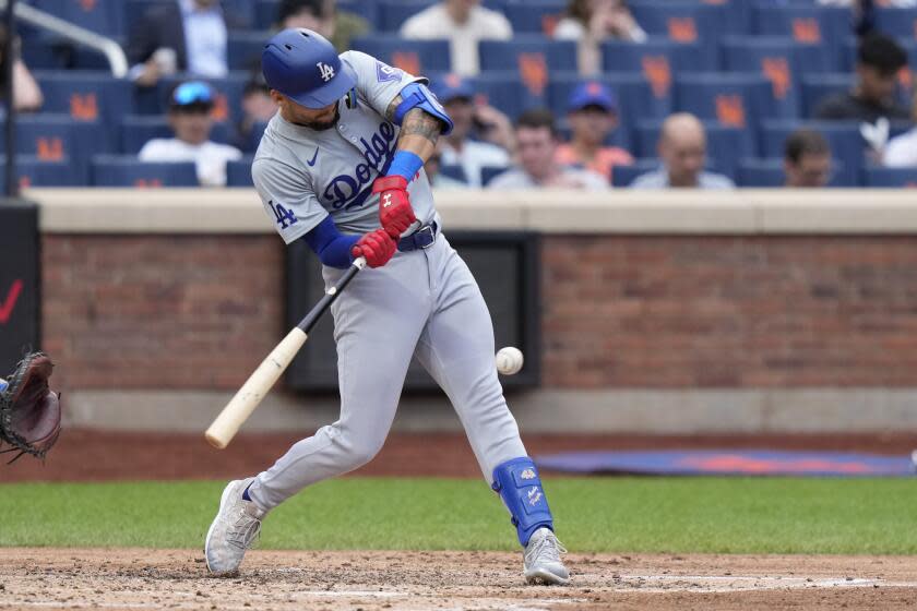 Los Angeles Dodgers' Andy Pages hits an RBI single during the fourth inning of a baseball game.