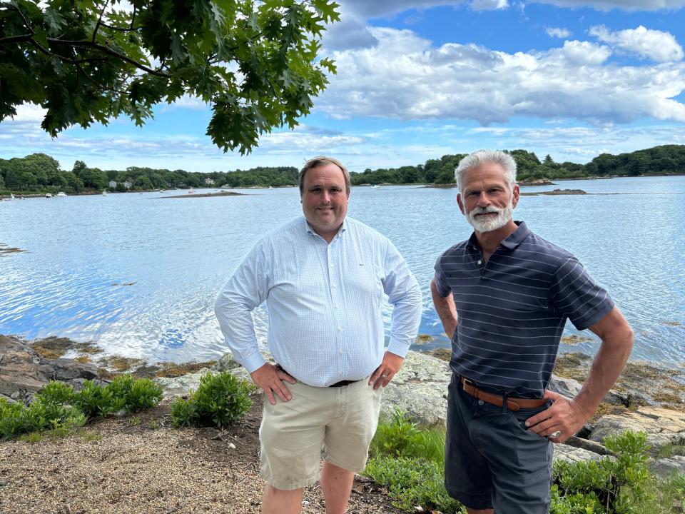 Dave Severance (left) and Doug Pinciaro of the Kittery Point Yacht Club are asking the town of New Castle to approve a 100-foot-long dock off this patch of club-owned land on Goat Island.