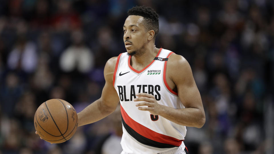 Portland Trail Blazers' CJ McCollum (3) brings the ball up court against the Charlotte Hornets during the first half of an NBA basketball game in Charlotte, N.C., Sunday, March 3, 2019. (AP Photo/Chuck Burton)