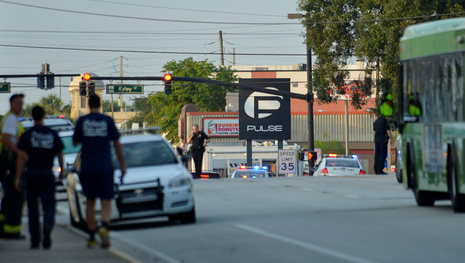 <p>Police lock down Orange Avenue around Pulse nightclub, where people were killed by a gunman in a shooting rampage in Orlando, Florida June 12, 2016. (REUTERS/Kevin Kolczynski) </p>